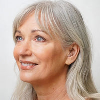 Side profile view of Torch over the counter hearing aid by Ceretone. Discreet and small design hearing aids.