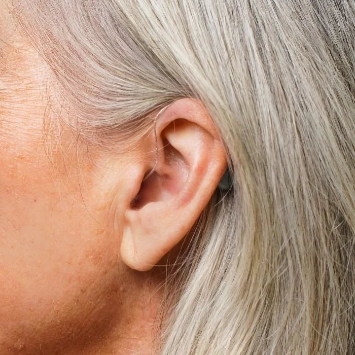 Ceretone Beacon behind the ear over the counter hearing aid on ear discreet look.
