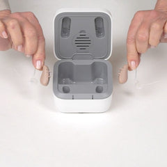 Video of Solid over the counter hearing aid, removing them from the charging case and hands on size comparsion.