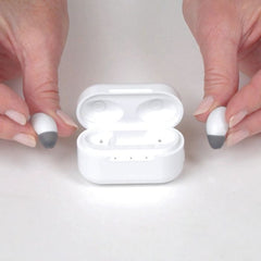 Style Hearing aid video, size comparison with hands and out the charging case view.