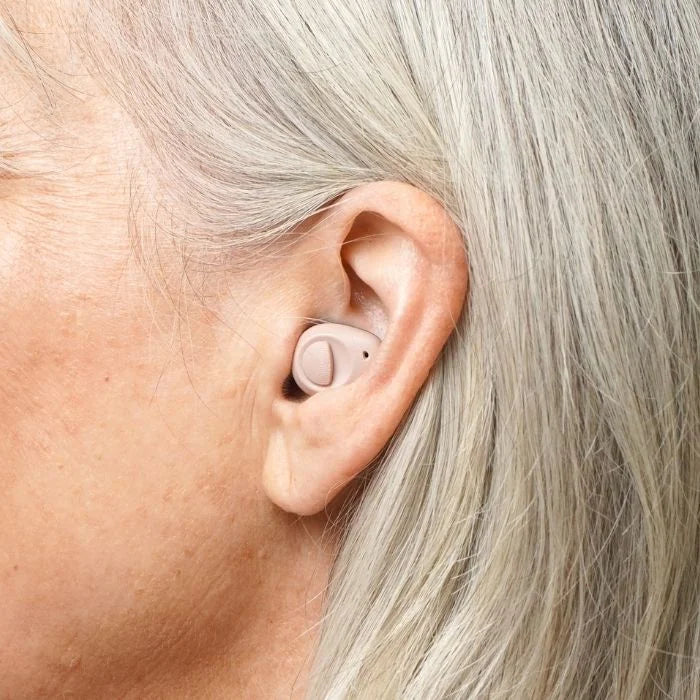 Torch OTC hearing aid nearly invisible and discreet in the canal and discreet, tan color hearing aid.